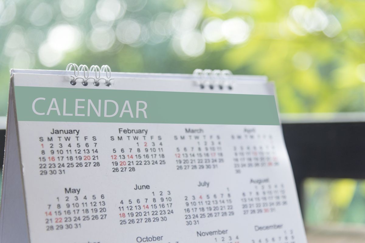 2024 Calendar Event Planner. Close up on calendar on desk with bokeh and sun light as a background with copy space. Schedule using calendar set timetable on organize schedule. Timeline Concept.